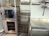 a metal rack with a bunch of food inside of it