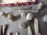 many different types of silverware on a table