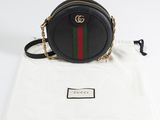 guccissi black round cross body bag with gold chain strap