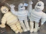three stuffed mummys in a plastic container with a price tag