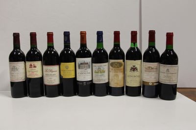 several bottles of wine are lined up in a row on a table
