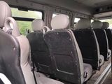 many seats in the back of a bus that are empty