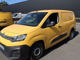 citroen van parked in a parking lot in front of a building