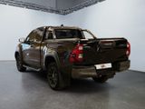 a black pickup truck parked in a garage
