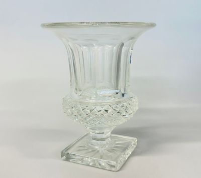 a close up of a clear glass vase on a clear surface