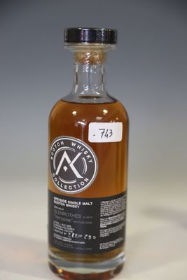 an empty bottle of whisky sitting on a table