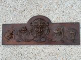 a metal plaque with a lion on it on the ground