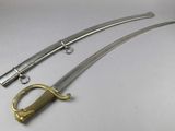 a close up of two swords on a white surface