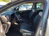 the interior of a car with black leather seats and a steering wheel
