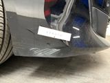 a close up of a car with a sticker on it ' s bumper