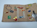 a piece of cardboard that has a bunch of pins on it