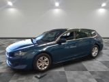 a picture of a blue car parked in a garage
