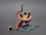 a figurine of an octopus and a man on a boat