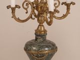a gold candelab with five candles on it