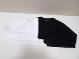 two white and black shirts on a white table next to each other