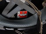 a close up of a helmet with a tag on it