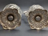 pair of antique silver plated candlesticks with floral design
