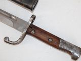 a knife that is laying on a table