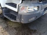 a white truck that is parked on the side of the road