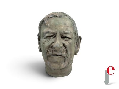 a bust of a man with a moustache on his face