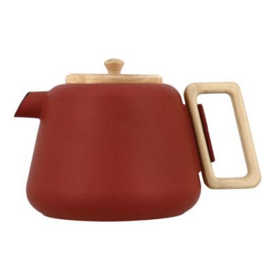 red teapot with wooden handle on a white background