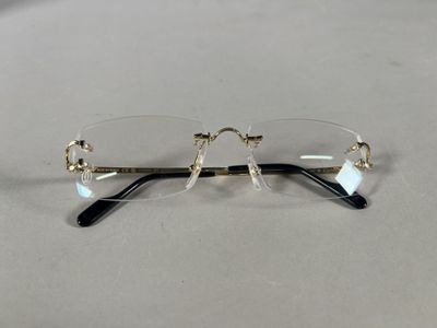 pair of glasses on a table with a white table cloth