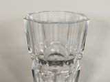 a glass vase that is sitting on a table