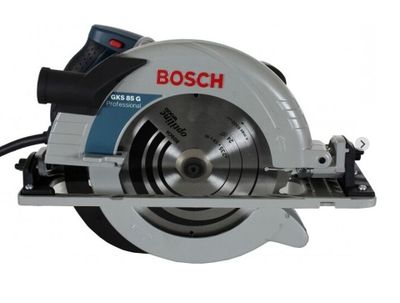 a close up of a circular saw on a white surface
