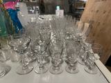 a lot of empty wine glasses on the table