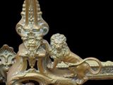 a statue of a lion and a bird on top of a table