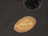 a black suitcase with a brown label on it
