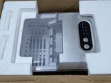 a white box with a remote control inside of it