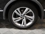 a close up of a car wheel on the ground