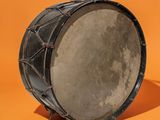 a close up of a drum on an orange background