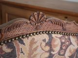 a close up of a couch with a floral pattern on it