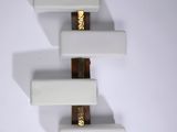 a picture of a wall mounted shelf with a knife on top of it
