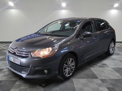 the grey citrole is parked on a checkered tile floor