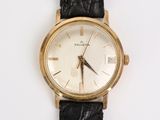 an image of a close up of a wrist watch on a white surface