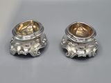 pair of silver plated candlestick holders with a lion design