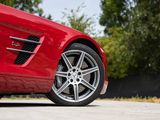 mercedes sl6 amg wheels on a red car parked in a parking lot