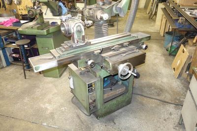 a machine that is sitting in a room with many tools