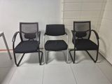 three chairs sitting next to each other in a room