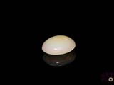 an image of a white stone on a black surface