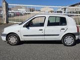 a picture of a small white car parked in a parking lot
