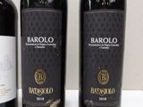 three bottles of wine that are sitting on a table