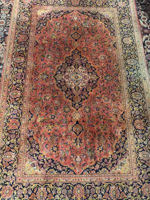 an oriental rug with a medallion design on a black ground