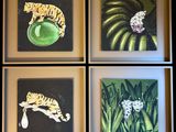 quatre tableaux encadrés représentant un tigre, un léopard et une grenouille