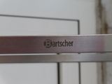 a close up of a stainless steel shelf with the name bartscher on it