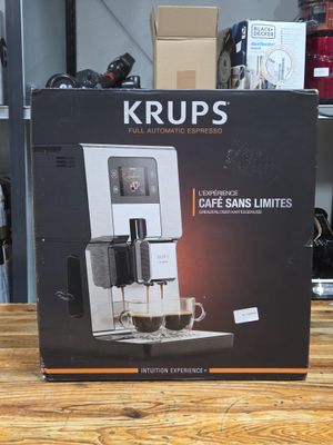 packaging of a coffee machine sitting on top of a wooden table