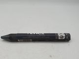 a black pen that is laying on a white surface